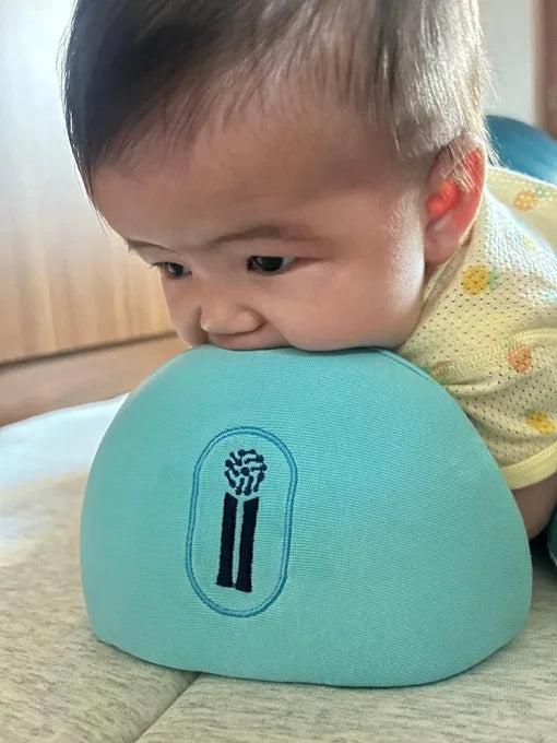 Baby in supported tummy time position on The Core